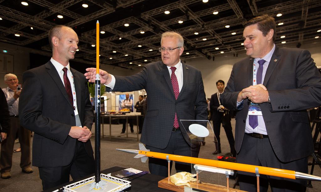 The Prime Minister of Australia Scott Morrison, centre, joined Lloyd Damp of Southern Launch, left, and Ian Spencer of DEWC Systems at the 9th Australian Space Forum in Adelaide for the announcement of the first payload to be launched from South Australia. Photo: James Knowler